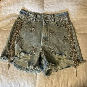 Denim shorts with star embellishments